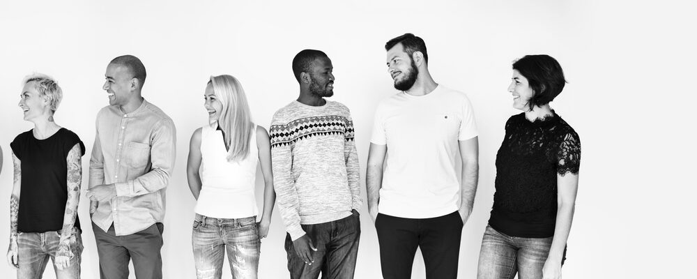 Group of cheerful diverse people in black and white